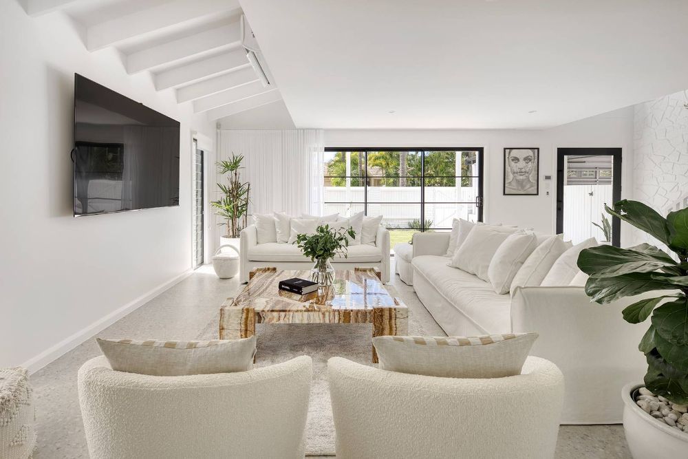 Living Room Filled With Furniture and a Flat Screen Tv — Beith Building & Developments Pty Ltd In Burleigh Heads, QLD