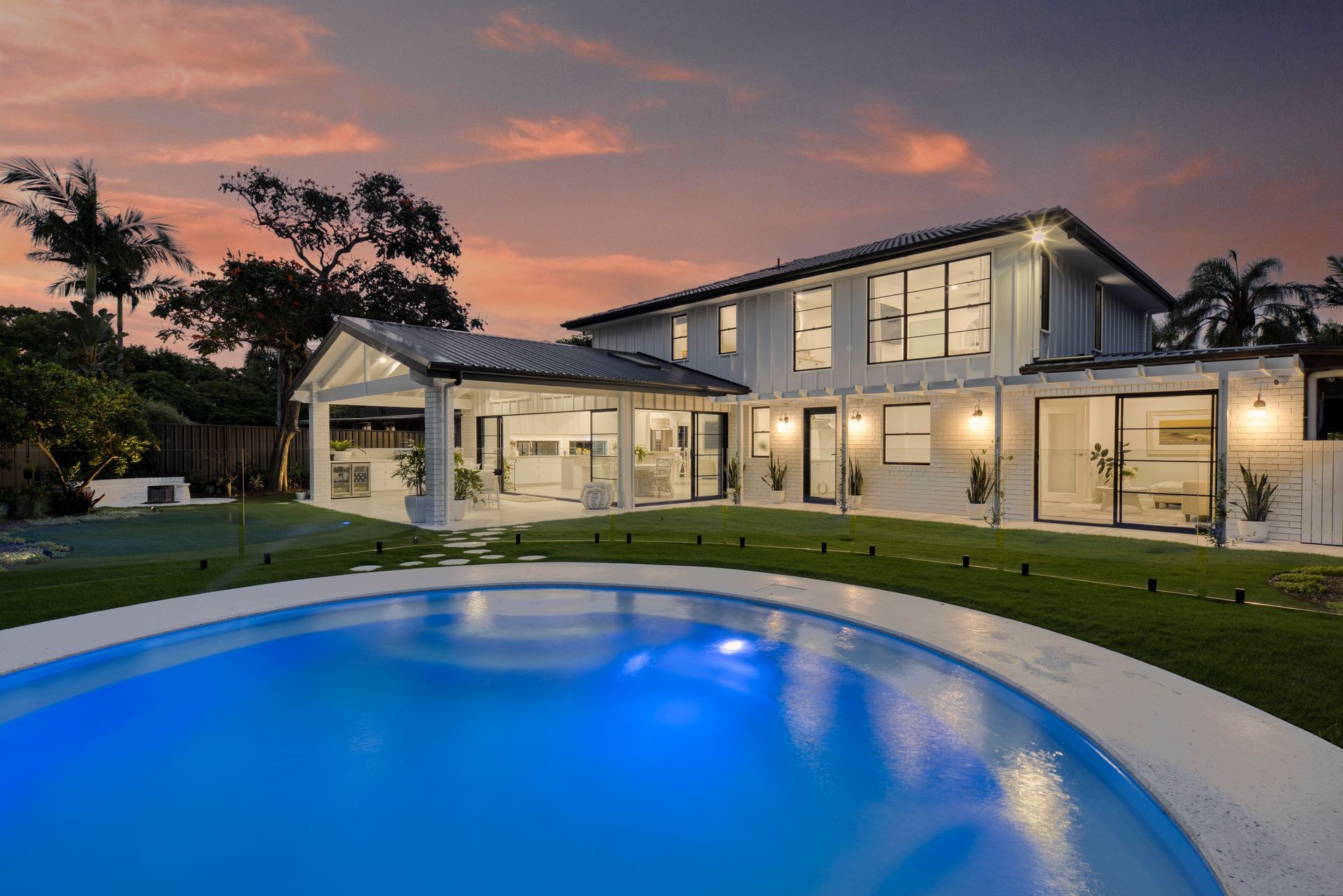 Large House With a Swimming Pool in Front of It — Beith Building & Developments Pty Ltd In Burleigh Heads, QLD