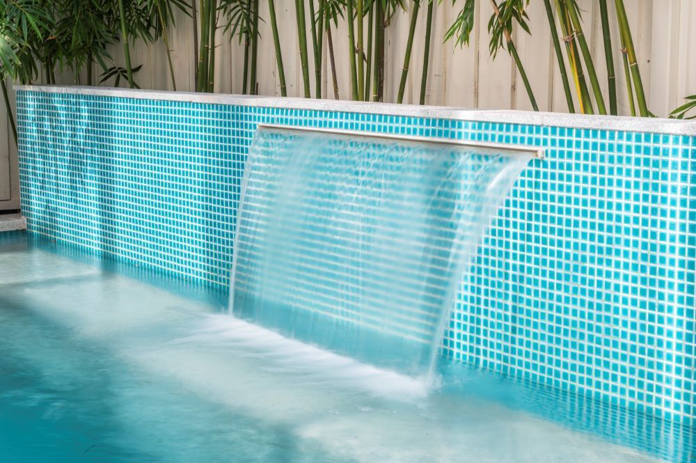 A Waterfall in the Middle of the Pool — Beith Building & Developments Pty Ltd In Burleigh Heads, QLD