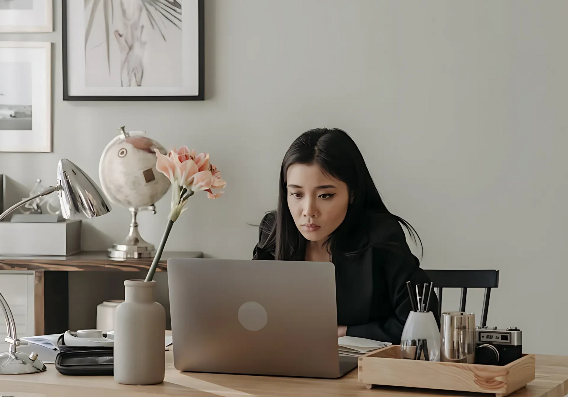 Women in black long sleeve using laptop
