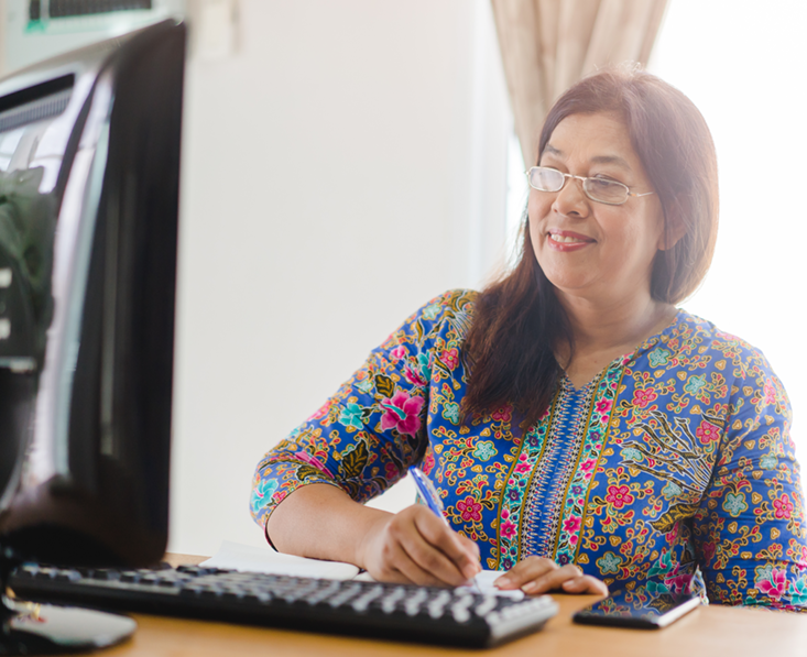 Thai woman at a computer