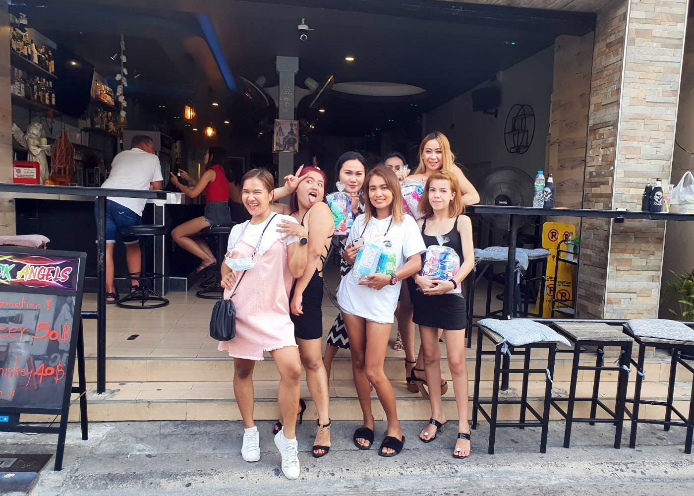 Thai friends outside of a bar