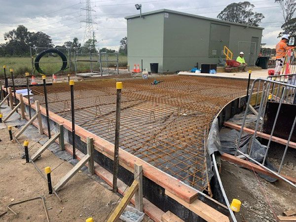 A group of construction workers are working on a construction site.