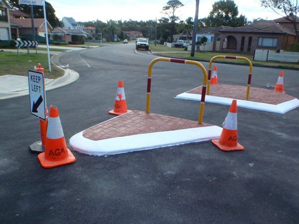 A road with a sign that says keep left