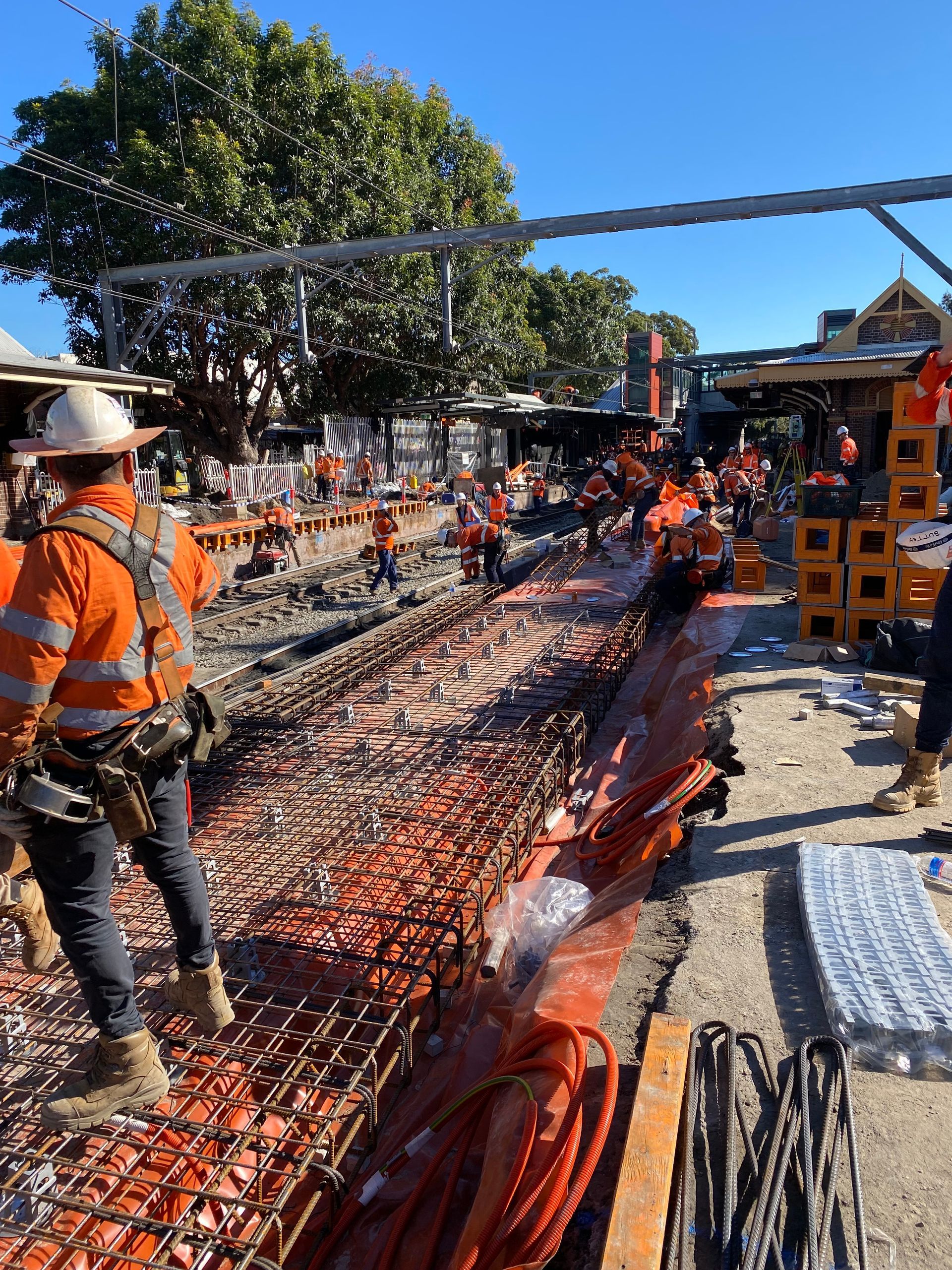A group of construction workers are working on a construction site.