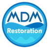 Blue circular logo for MDM Restoration. Contains white text and stylized waves.