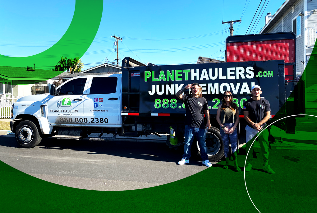 A group of people standing in front of a junk removal truck.
