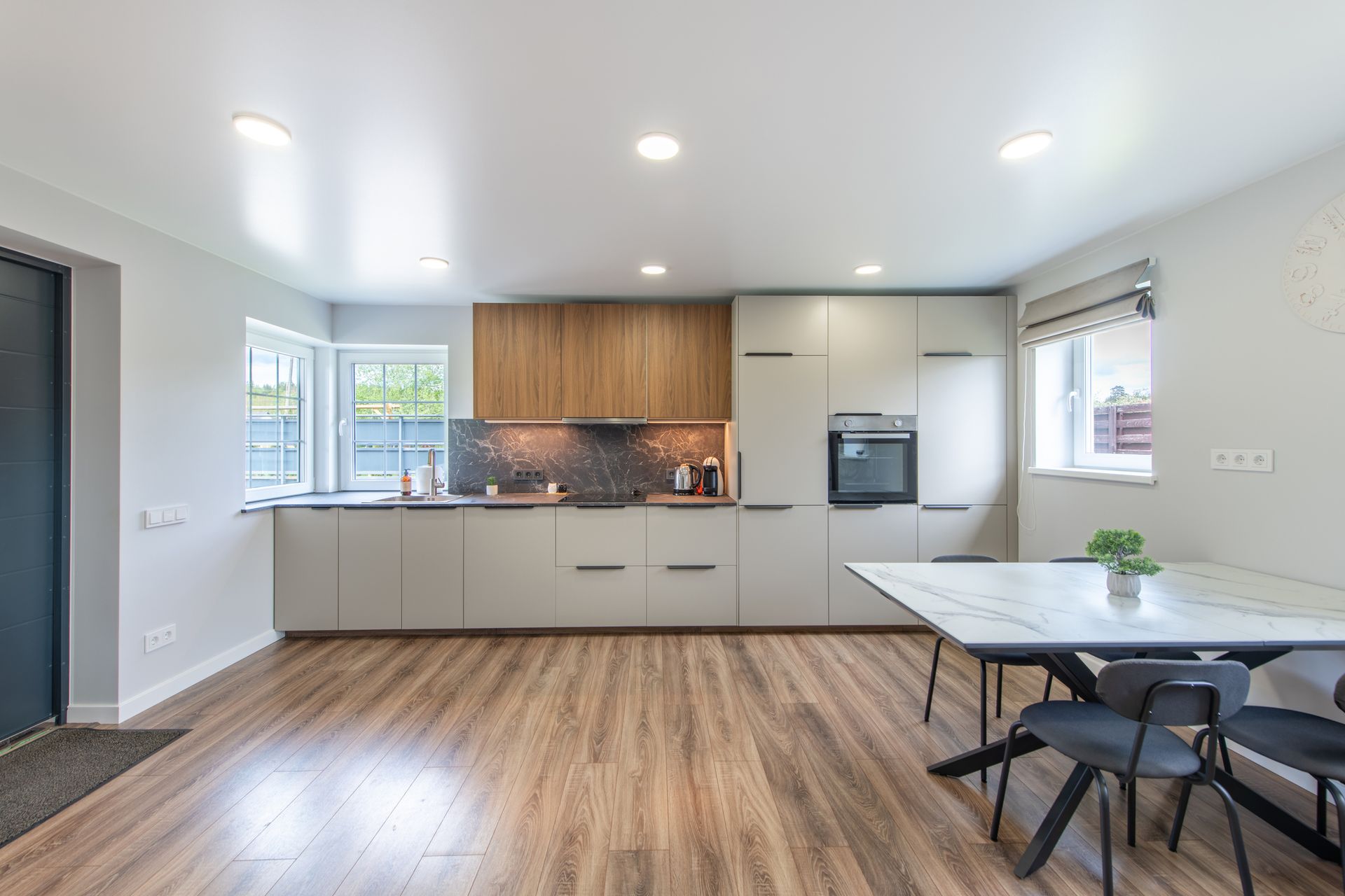 Herringbone pattern hardwood floor, light brown.