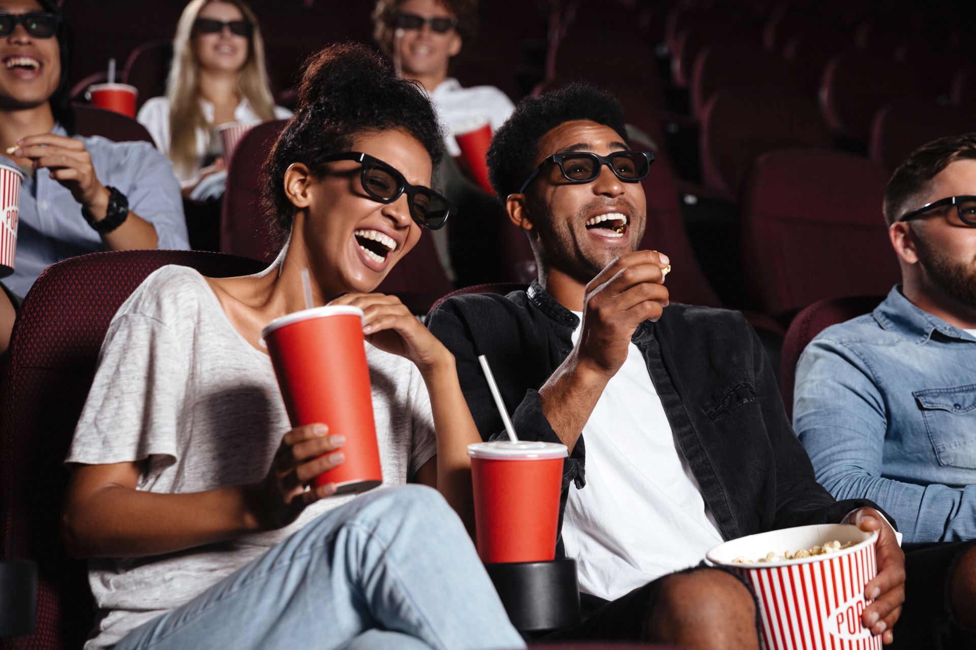 Photo of people laughing in a movie theater