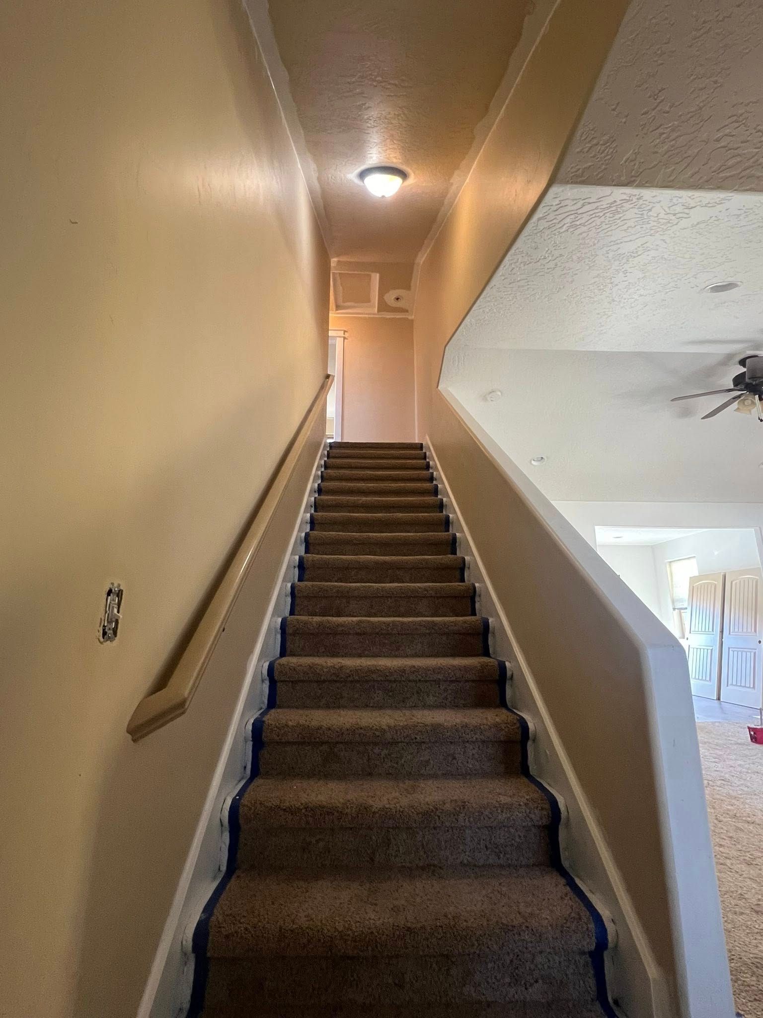 A set of stairs leading up to the second floor of a house.