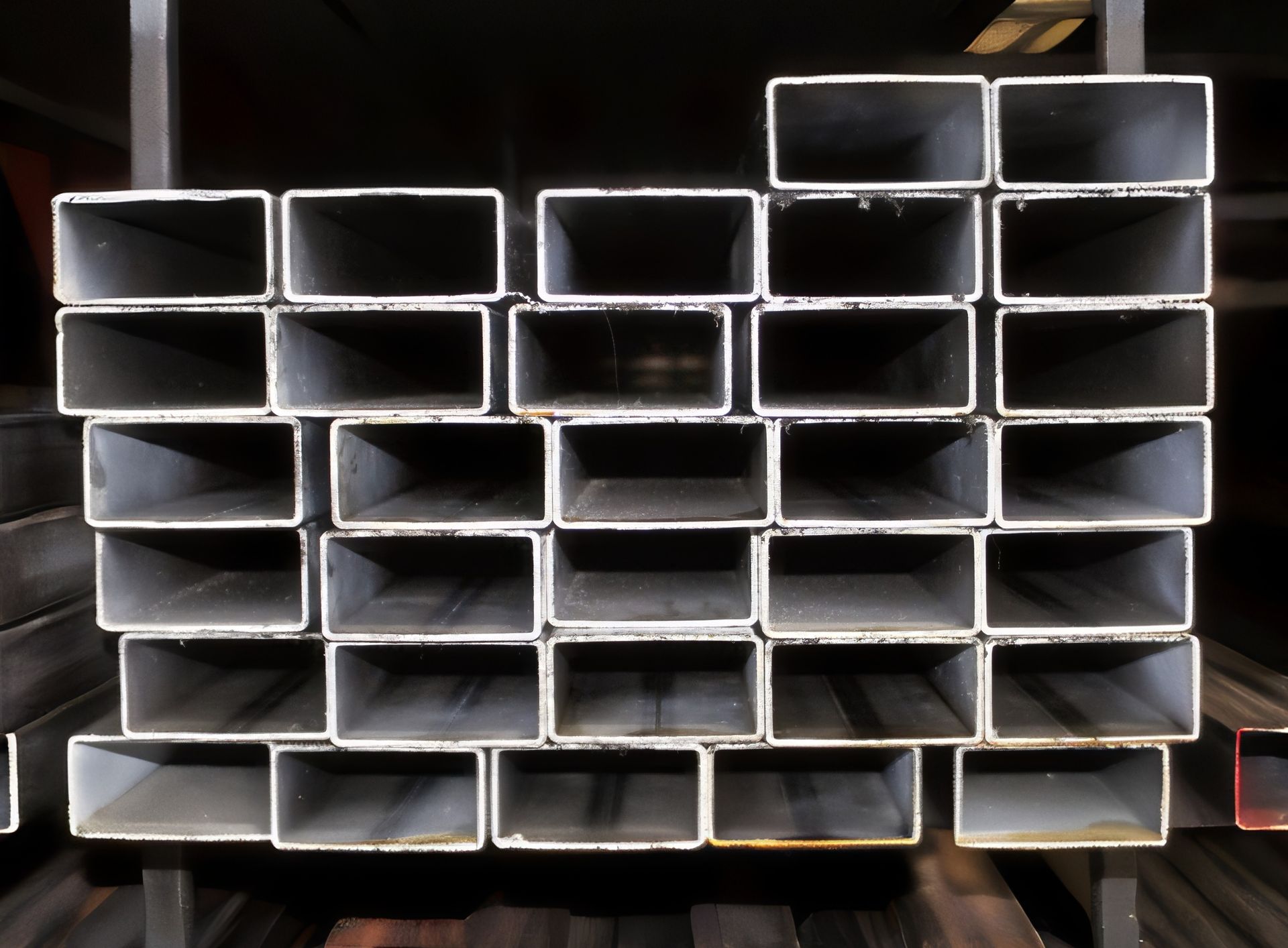 Stack of rectangular metal tubes.