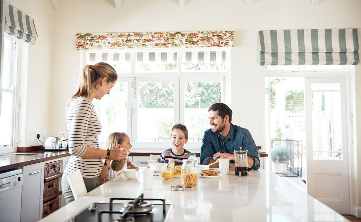 Family having breakfast together in the kitchen — Redding, CA — Steven A. Small Attorney at Law