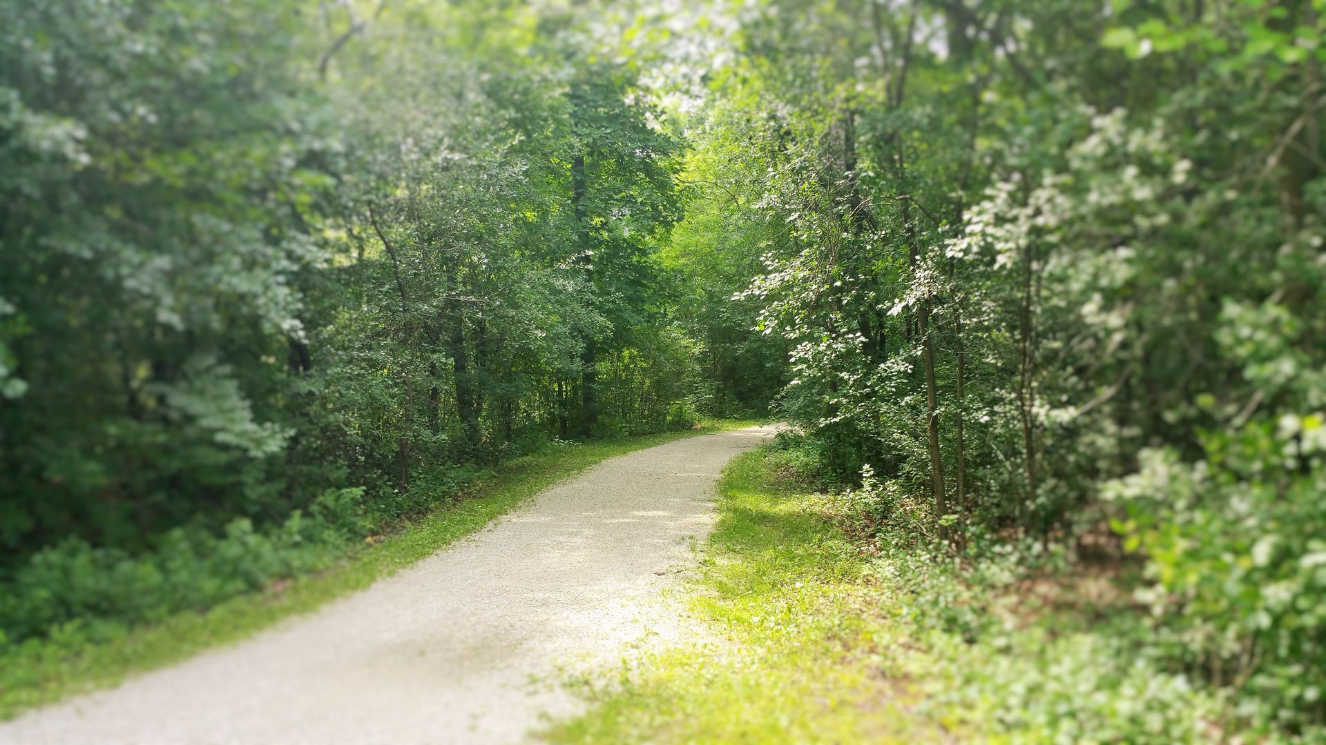 A sunset over a mountain range with a cloudy sky