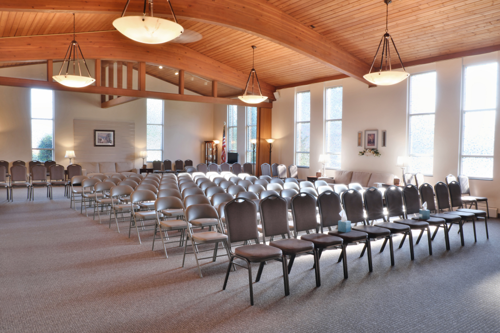 Rows of chairs are lined up in a large room