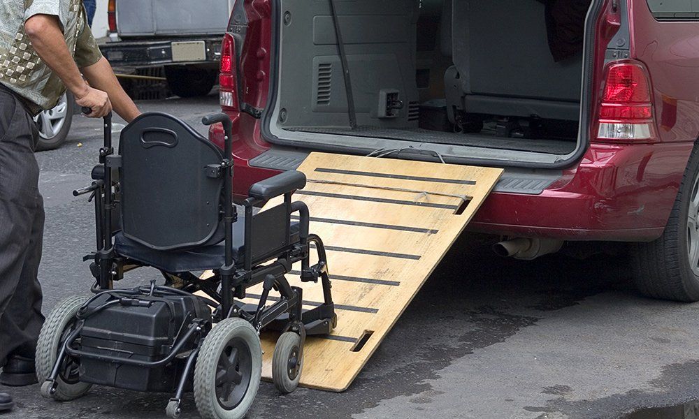Loading Wheelchair Into The Vehicle — Chicago, IL — Metropolitan Insurance Service Consultants, Inc