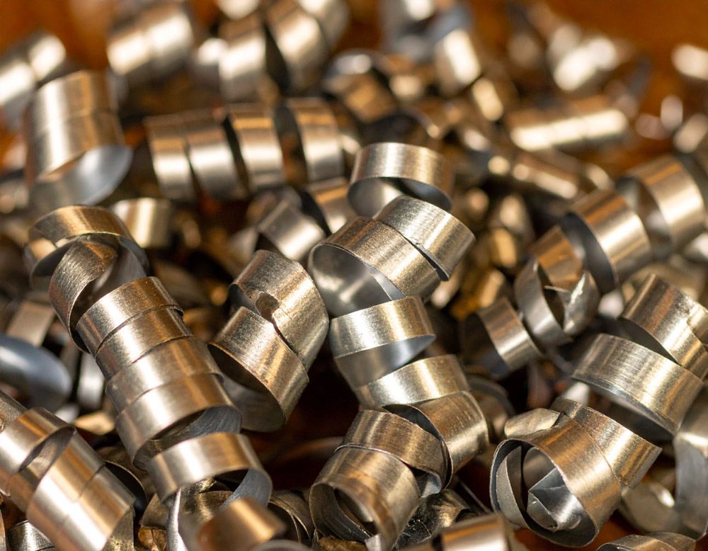 A pile of metal scraps, and aluminum turnings