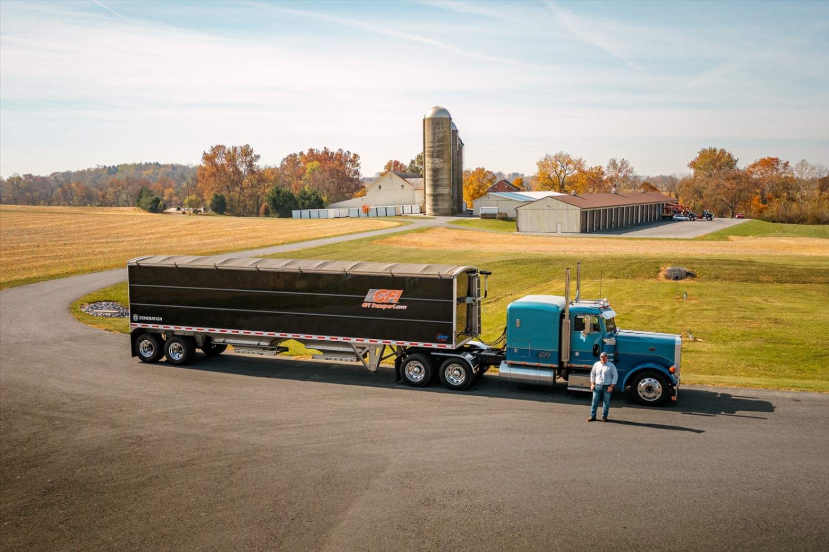 A GFI Transport semi truck is parked in a parking lot ready for corn shipping.