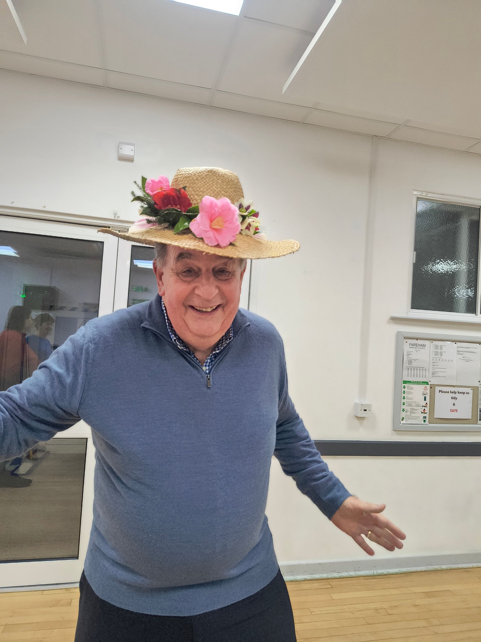 Photo shows Glenn Duggan wearing the 3rd place hat