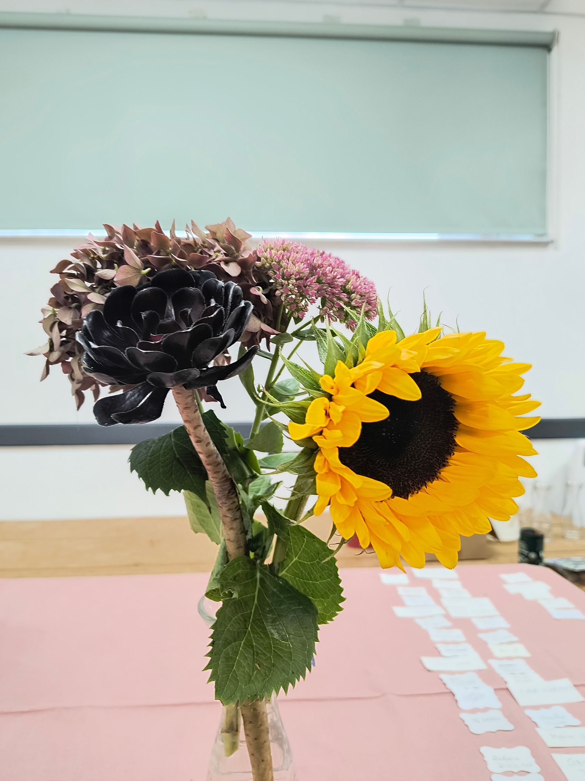 Photo shows an arrangement of fresh flowers. Methinks someone misunderstood the brief.