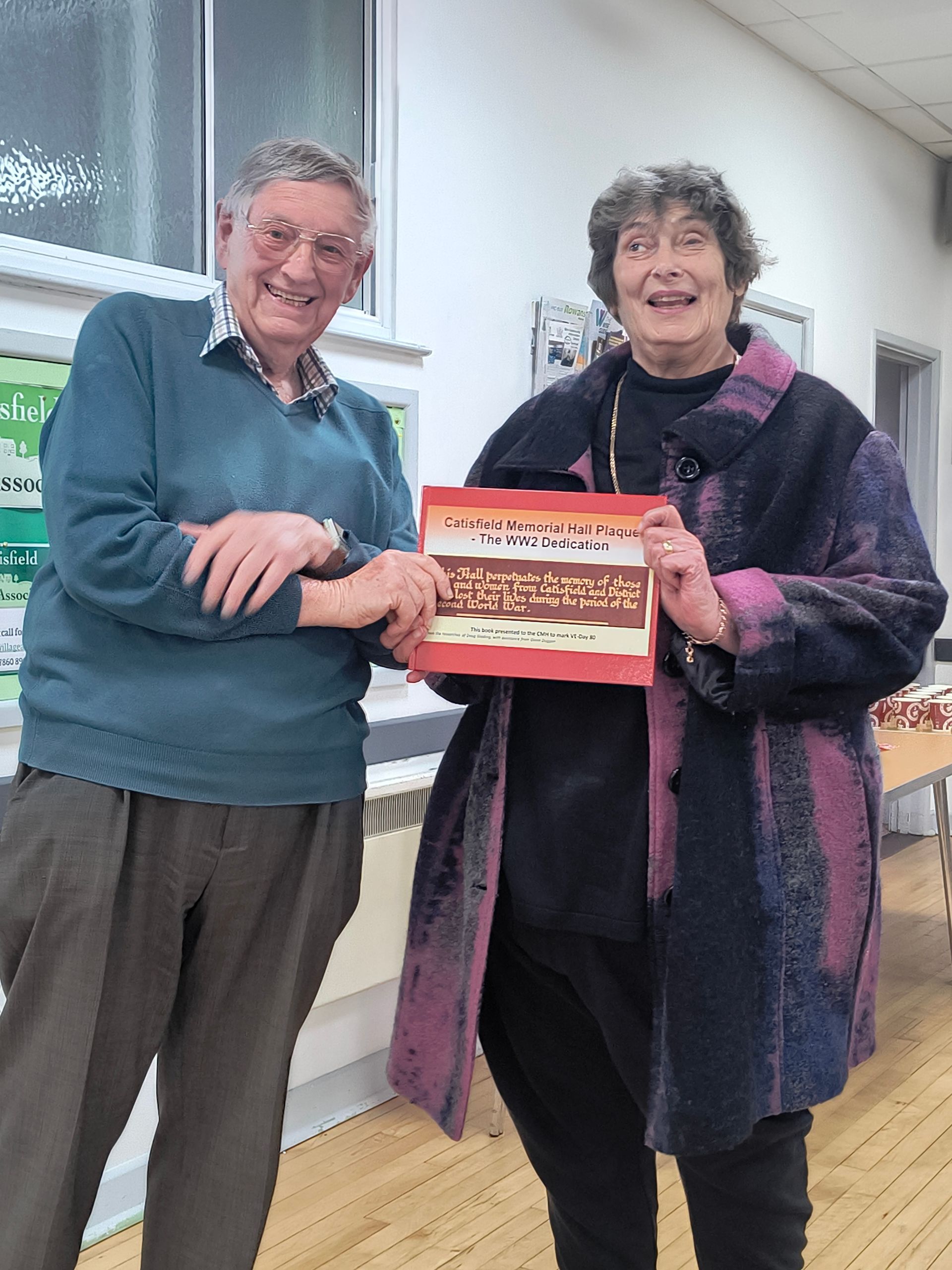 Doug presents the book to Penny