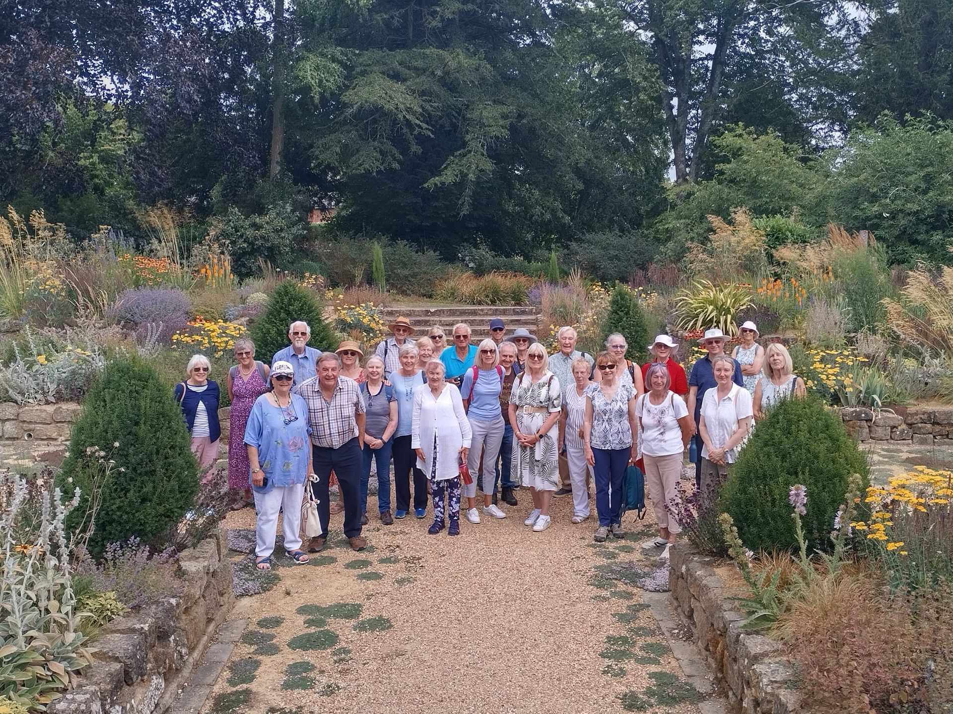 Members gathered in the sunken garden