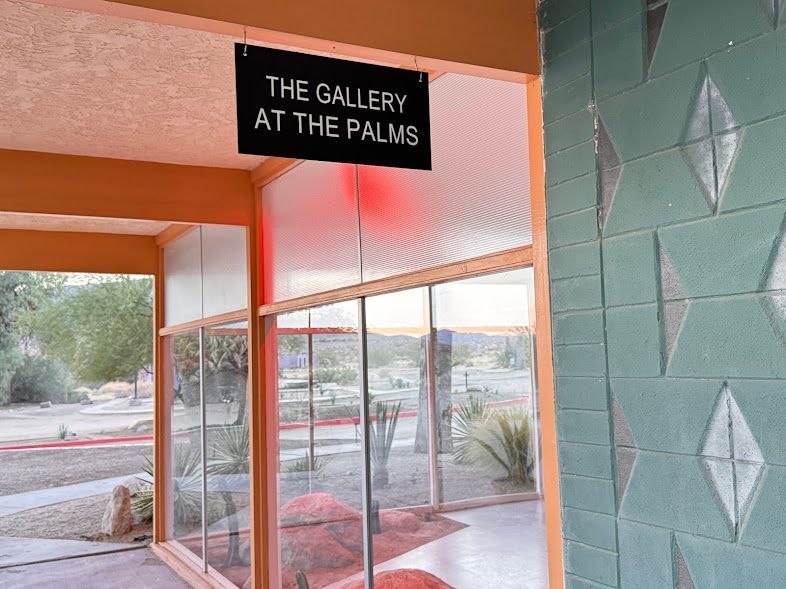 A sign that says the gallery at the palms on it