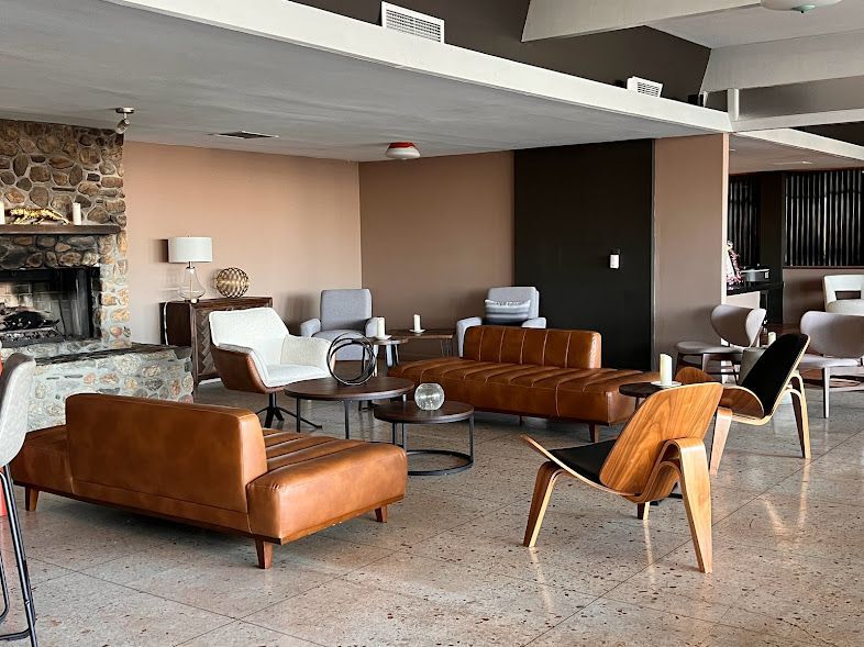 A living room filled with furniture and a fireplace.