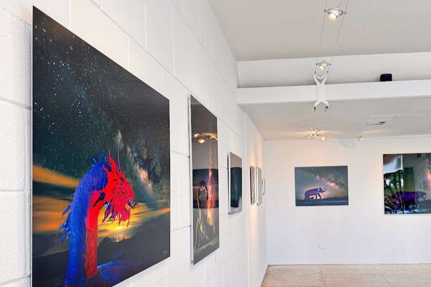 A room with a lot of paintings on the wall