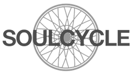 A black and white logo for soul cycle with a bicycle wheel in the center.