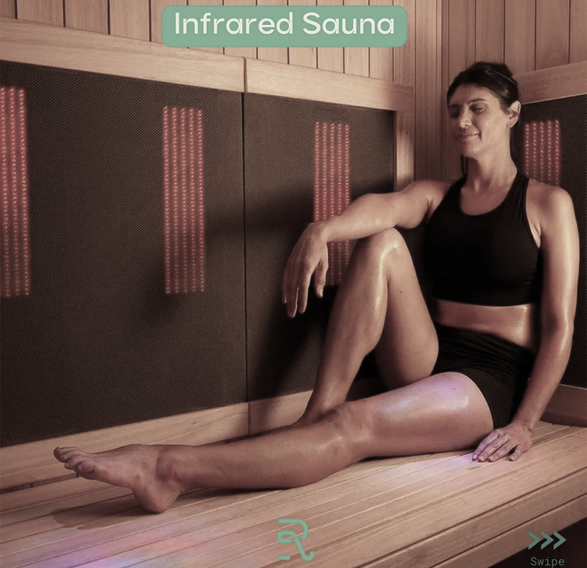 A woman is sitting on a bench in an infrared sauna