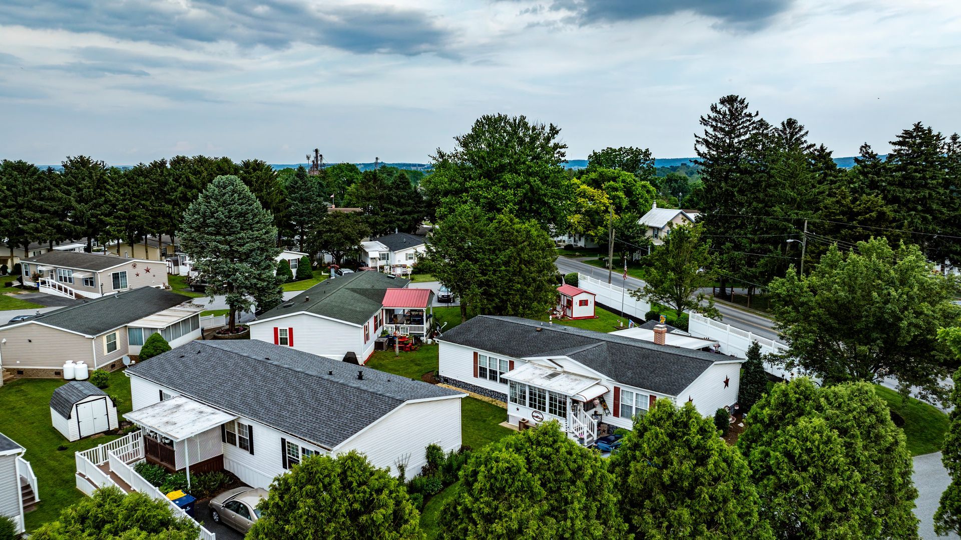An aerial view of a residential area with lots of houses and trees.