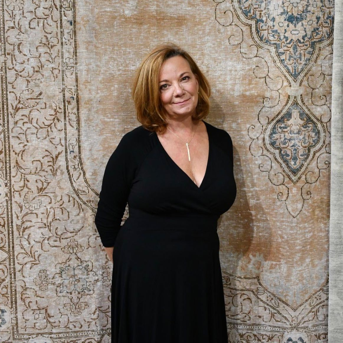 Coleen in front of a rug