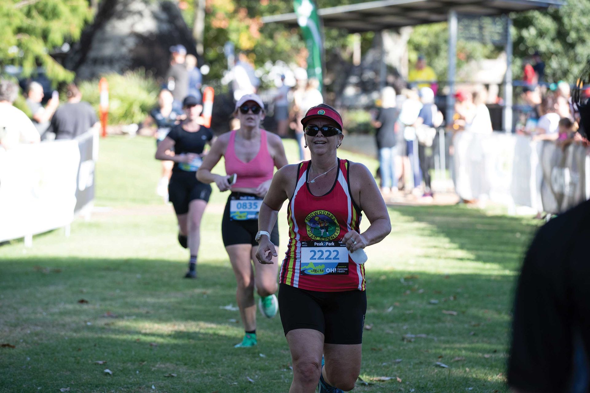 Group of people running along at the Peak2Park event