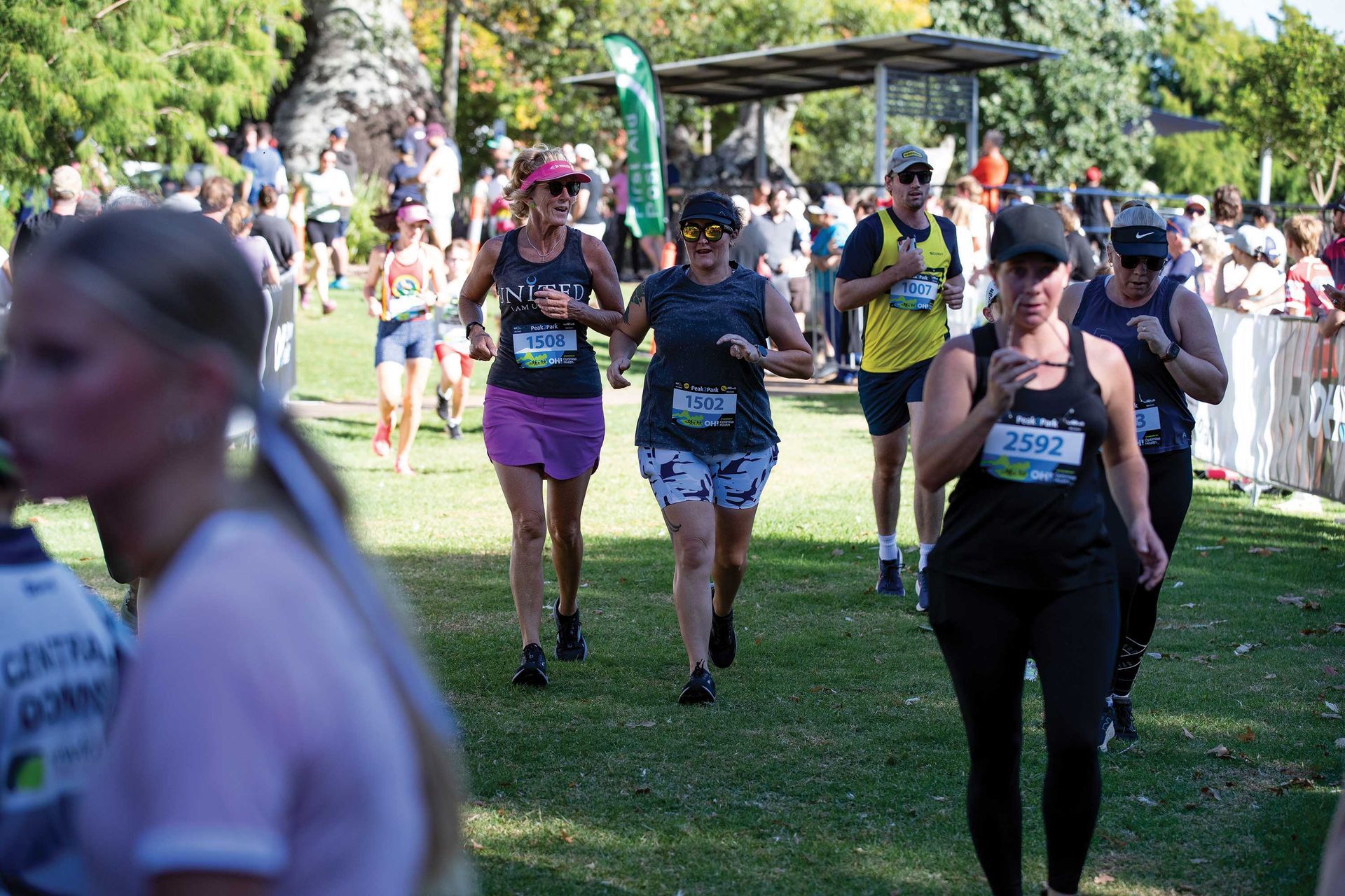 Group of people running along at the Peak2Park event