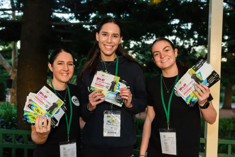 Group of people running along at the Peak2Park event