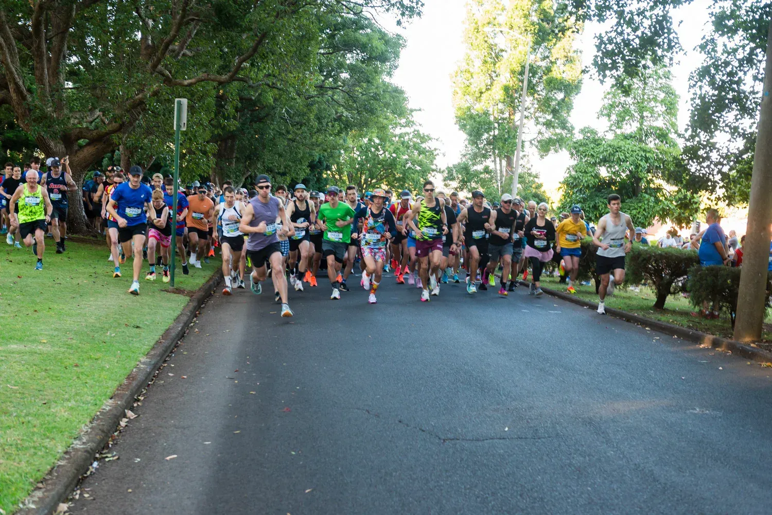 Group of people running along at the Peak2Park event