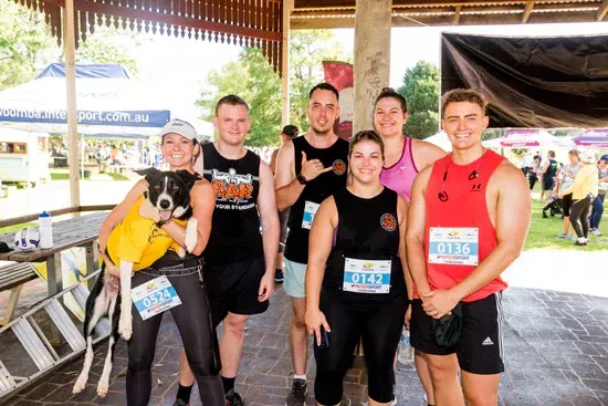 Group of people running along at the Peak2Park event