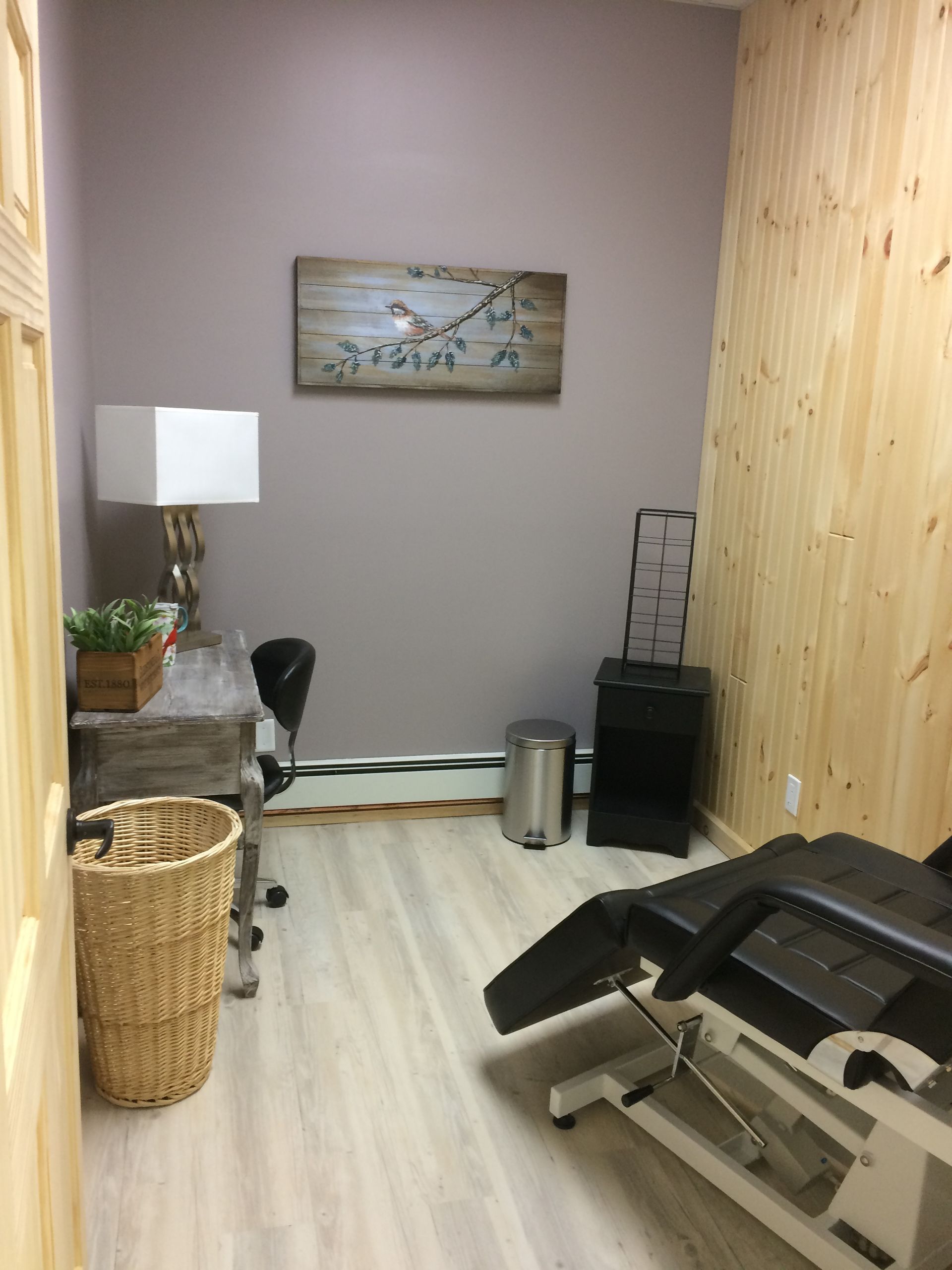 A small room with a chair and a desk