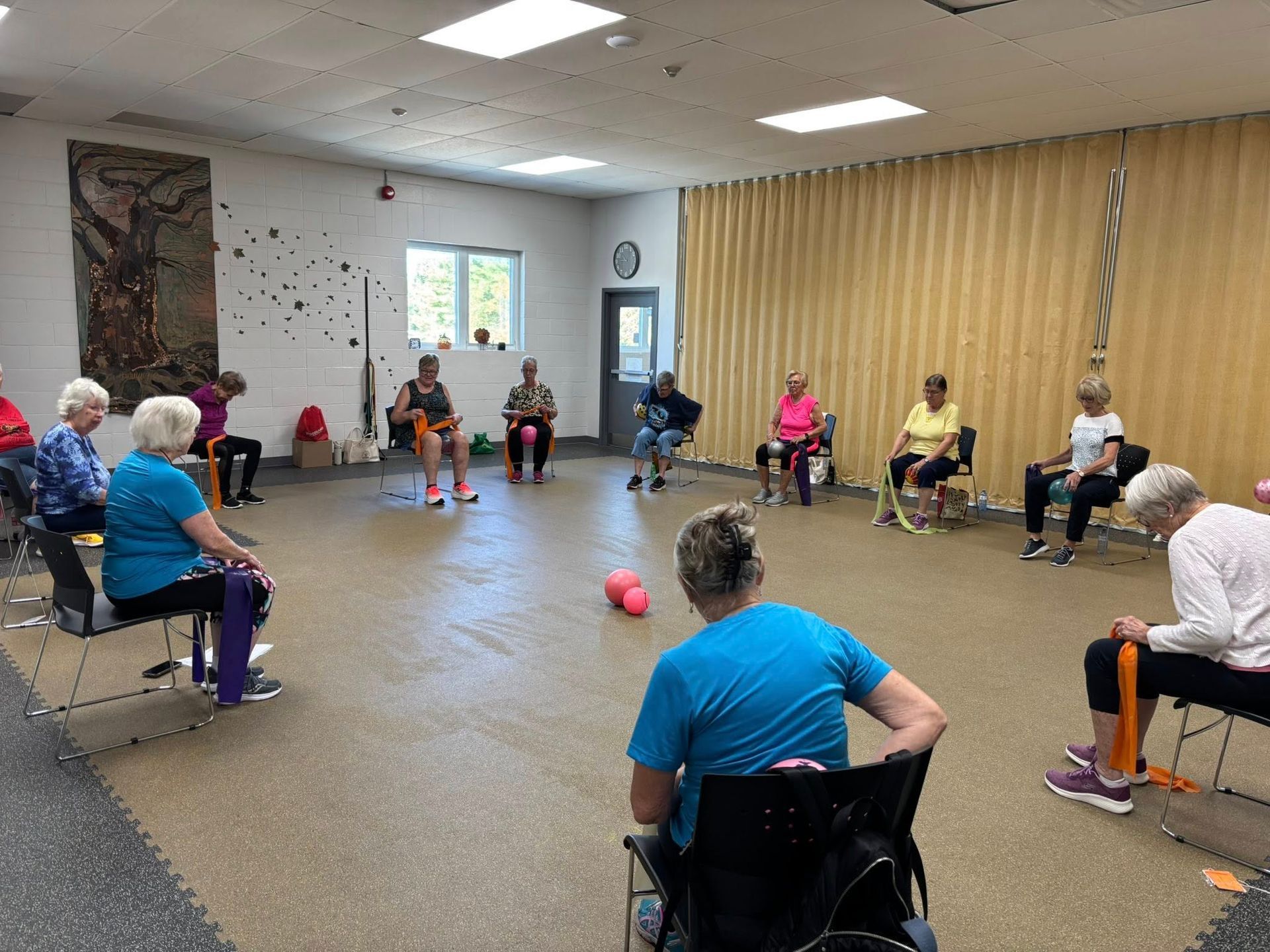 A man is sitting in the driver 's seat of a car.