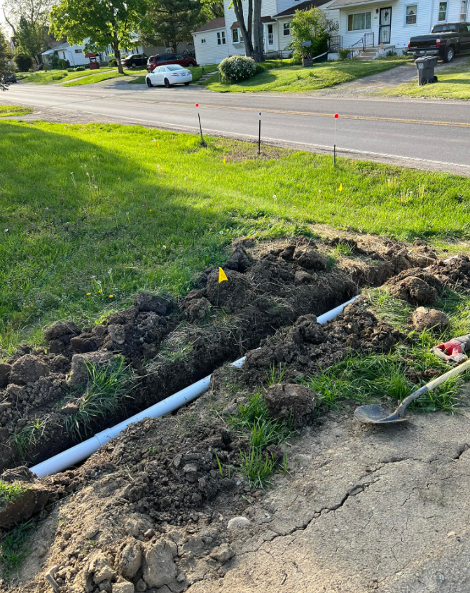 A White Car Is Parked On The Side Of The Road | Pickerington, OH | Drainco LLC