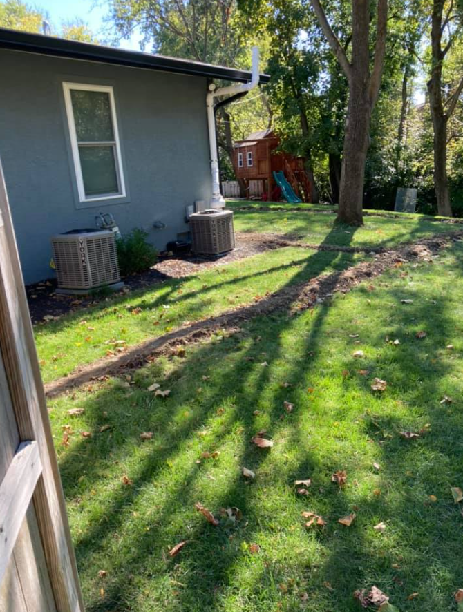 The Backyard Of A House With A Lawn And A Shed In The Background | Pickerington, OH | Drainco LLC