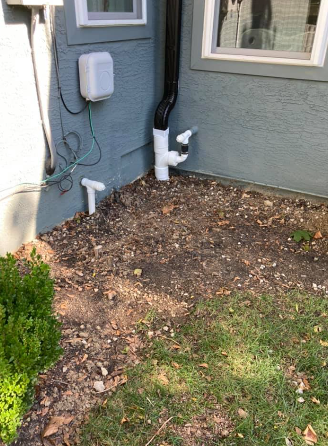 A House With A White Box On The Side Of It | Pickerington, OH | Drainco LLC