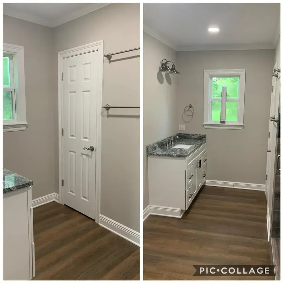 Two views of a newly renovated bathroom with white cabinetry, gray walls, and dark wood-look flooring.