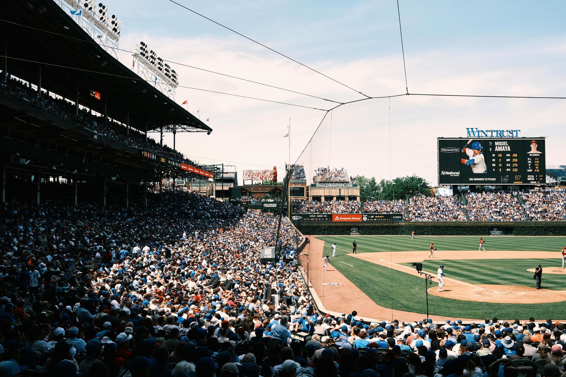 The Cubs stadium filled with people watching the game.