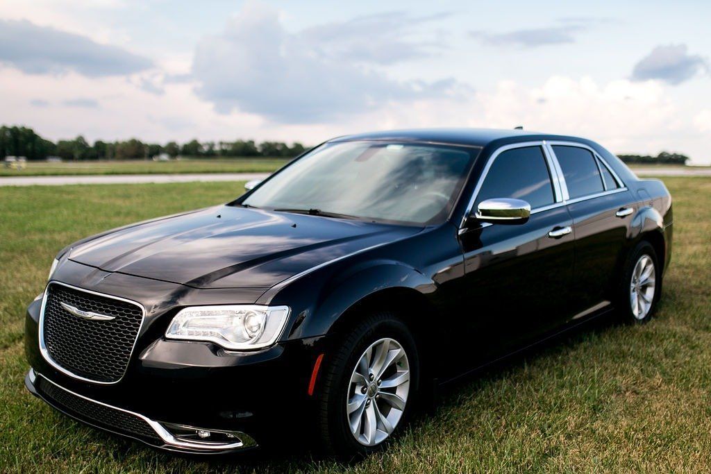Chauffeured sedan parked and ready for pickup