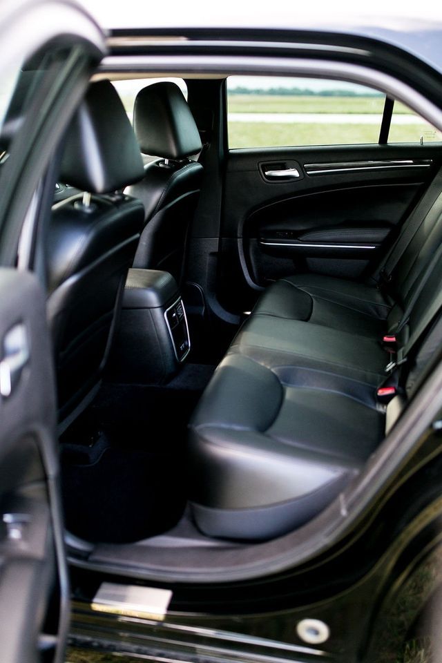 Chauffeured black sedan offering elegant travel experience