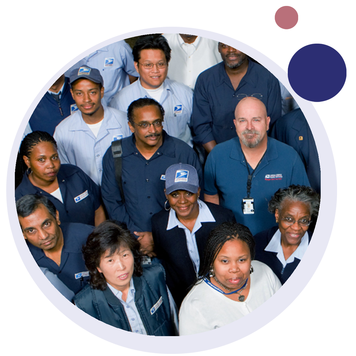 A group of USPS postal workers are posing for a picture with blue uniforms on.