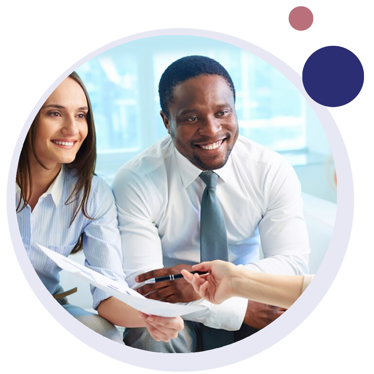 A man and a woman are sitting next to each other looking at a piece of paper with an agent.