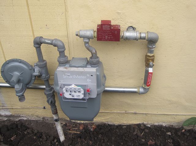 Gas meter against a wall