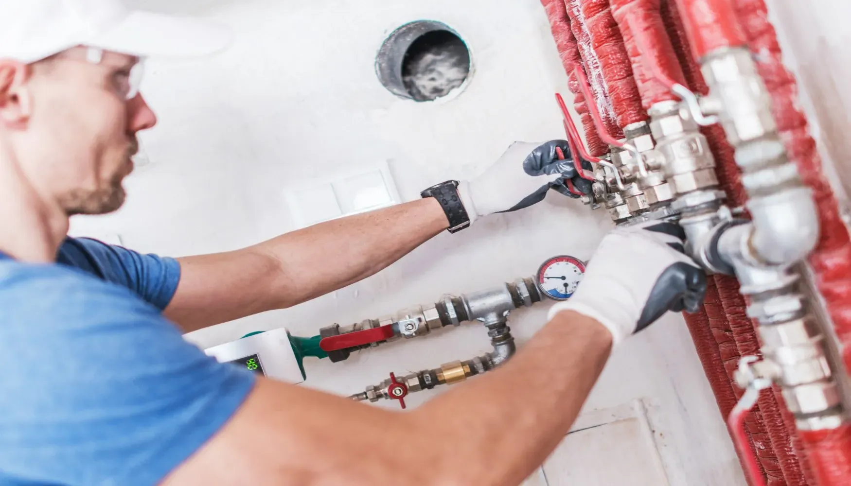 plumber checking gas pipes 